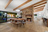 The original stone fireplace separates the living and dining areas.
