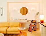 Sofa: Vladimir Kagen Sofa  Sconces: Meander Wall Lamp by Casati and Ponzio  Photo 8 of 9 in One Night in Palm Heights, the Internet-Crowned “It Girl” Getaway