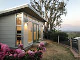 The prefab’s metal roof rests on plywood rafters, which can be stained or painted for $1,400. Clients also have the option to shorten the eaves to six inches for an extra $200.