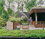 A 580-square-foot terrace complete with outdoor kitchen sits above a new garage. The terrace’s design was inspired in part by New York’s High Line, says Rick, with its varied and immersive plantings, expanded steel-mesh guardrail, and lighting beneath ipe handrail caps.