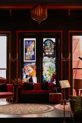 Keeping the spirit of a church, the front windows have been filled with stained glass portraits of Mavis Staples, David Bowie, and Gena Rowlands. (The Staples and Bowie portraits are by Toronto artist Hadyn Butler, and Rowlands is by Iurii Voloshchuk at Galician Stained Glass.)