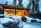 Prefab prefabricated yoga fitness studio designed by Grouparchitect and built by Method Homes near Lake Tahoe, CA with glass facade, tall ceilings, and long overhanging roof eaves.