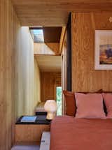 More surfaces in cork—a side table, the frame for a skylight—punctuate the CLT.