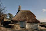 Exterior of Thatched Roof Cottage Renovation by Stopher Design