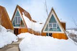 The two structures that comprise the home are connected by a breezeway and a Nordic sauna.  Photo 2 of 5 in He Had a Vision: to Build an A-Frame Cabin Almost Entirely Out of Beetle Kill Pine