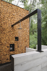 Natural materials such as concrete, stone, and wood give the architecture a rugged honesty.