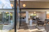 Sliding glass doors wrap the courtyard at the heart of the home.