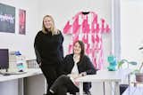 Portrait of sisters Anda and Jenny French of Boston-based architecture firm French 2D sitting in their office.