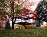 Steel skeleton structure of Aluminaire affordable housing prototype house by A. Lawrence Kocher and Albert Frey stands on a grassy hill in the fall.