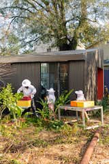 The couple completed the workshop before the house to stage the DIY components of the project. The family added a beekeeping area just outside it.