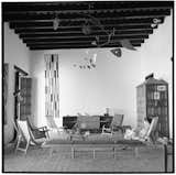 Another photo shows the Pampatar house with chairs by Arroyo and art from Boulton’s collection.