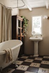 A large clawfoot tub awaits in one of the two bathrooms.