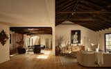 Exposed beams stretch across the vaulted wooden ceilings in the main living areas.