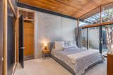 A light-filled bedroom opens to the home’s central courtyard.