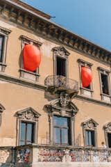 They did so by attaching outfits to large red balloons some of which bulged out of the villa’s windows.
