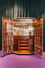 The first piece I saw was a new bar cabinet, silk screened rather than painted for a more 2D look. Cats, birds, bottles, and urns decorated the face as well as the inside of the doors.