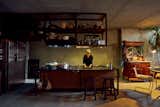 Hao designed the open kitchen, which features belian shelving, a Verde Alpi marble countertop, and a copper sink. “I do everything in the kitchen, from work to play,” says Emylia, who calls the space an “idyllic” environment for both physical and psychological nourishment.