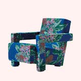 Blue Utrecht XL Outdoor Armchair by Cassina with green and pink leafy floral patterns.