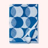 Sorrento Beach Towel by Sferra with pattern of blue and white overlapping circles.