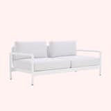 Lissoni Outdoor Sofa by Knoll with white metal base and white cushions.