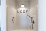 "Easy to clean and difficult to destroy"—the homeowners’ brief for their dog wash station—comes to life in the fun and functional grooming space, complete with custom penny tile which playfully spells out "WOOF."&nbsp;