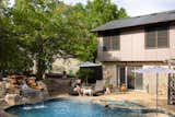 The architecture of the Fishers’ home—which was built in the early 1980s—is inspired by the traditional Hill Country style found in Central Texas and embraces natural materials such as limestone and timber. "The idea was to complement and feature the natural beauty of our neighborhood which is surrounded by cedar trees and green belts as well as a private golf course," says Jennifer.