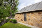 The Timberline Solar roof from GAF Energy seamlessly comprises of both traditional roofing materials and one-of-a-kind, award-winning nailable solar shingles.  Photo 3 of 7 in After the 2021 Winter Storm, a Texas Homeowner Transformed Their Stone Ranch Into a Solar Powerhouse