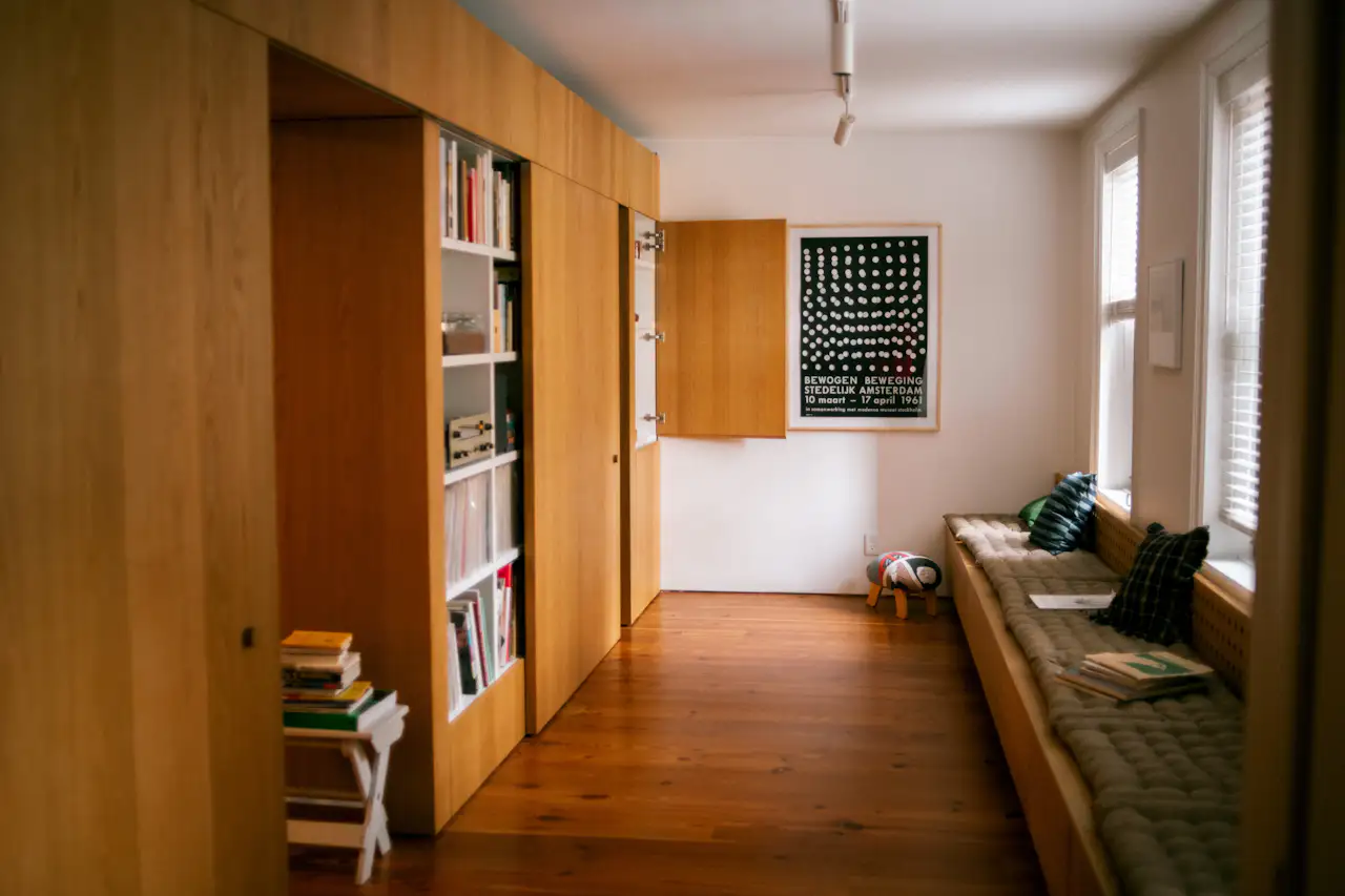 Photo 2 of 11 in A Multifunctional Storage Wall Solves a Tricky Spatial ...