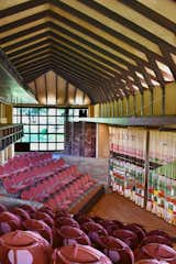 Wright's apprentices at Taliesin gave him the hand-sewn curtain made of colorful felt and yarn that hangs in the Hillside Theater as a birthday present in 1957. 