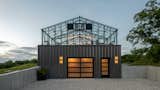 The greenhouse top as seen from the driveway. The garage and former basement level of the original building has been transformed into new living quarters, a small guesthouse, for when family and friends visit.&nbsp;