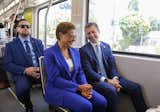 Los Angeles Mayor Karen Bass and U.S. Transportation Secretary Pete Buttigieg ride on Metro’s E line light-rail train.