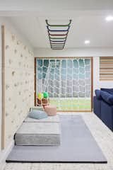 Rock climbing walls and monkey bars are popular features in many custom kids’ playrooms.