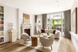 Floor-to-ceiling glass doors connect the second-floor living area with a private terrace.