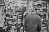 A man considers the vast selection of good-looking vintage stereos.&nbsp;