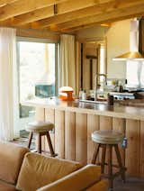 The kitchen features a countertop, seen here along the back wall, made from the stone taken out of the boulder.&nbsp;