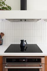 The renovation upgraded the home’s infrastructure from gas to electric, and Isaac built the minimalist range hood.