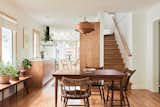 The renovation updated a pair of staircases—one to the basement, one to the upper level—from their steep, unsafe angle to one that is now up to code. In the dining room, the pendant by Hans-Agne Jakobsson is from Karoline’s family cabin in Germany.