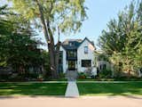 "It was really important to us that it not feel like a brand new house that just plopped down in this old neighborhood," says architect Beth DeBaker of Scott Simpson Design + Build. Taking cues from older stucco homes in the area, they settled on a Tudor-inspired design with a twin gable roof. "I'm very drawn to Tudor homes, so we knew we wanted to have a modern Tudor style for our home," says homeowner Carly Zuba.