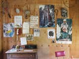 An assortment of posters hang on plywood walls in home in Concrete, Washington, designed by Jes Paone.