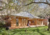 A Swooping Metal Roof Caps a House Set in a Normandy Garden