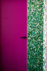 One of the bathrooms in Barbara and Karel’s apartment is clad in colorful tile in a nod to their daughters’ love of Minecraft.