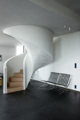 A sculptural stair connects Lien and Jeremy’s living area to a guest suite above.