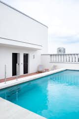 Rooftop pool in an apartment in a mixed-used building in Ghent, Belgium, designed by Jeremy Godenir, founder of MOEA Architectural Design Studio.