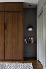 Beautiful custom cabinetry conceals the Murphy bed.