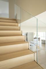 The glass guardrails on the staircase bring a sleek simplicity to the look, since the staircase isn’t hidden from view in any way. This allows for the FLIGHT Stack stair to look like it’s weightlessly floating across the interior, creating sculptural interest throughout.