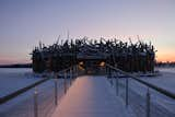 Sweden’s Arctic Bath hotel is designed to resemble a cluster of logs adrift on a river. The rounded structure floats on the Lule River during summer and freezes into its surface in winter.