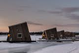 The hotel comprises six floating bungalows and six larger land cabins elevated on stilts.