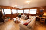 Dunregan House features numerous original details, including wood-paneled walls, hardwood floors, and large windows that framing riverfront views.