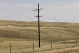 A power line stands in front of the Roundhouse Wind Project. Although Wyoming is the country’s largest producer of coal, the wind farm provided a lifeline during the Covid pandemic’s economic downturn, spiking tax revenue.