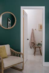 The forest green walls—in Sherwin Williams Shamrock—create a more intimate atmosphere than the lighter and brighter living areas, but still in touch with the inspiration taken from the natural world. They also hint at the green palette used in the guest bathroom.